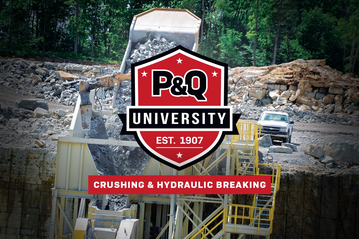 Photo showing a truck dumping shot rock into a crusher