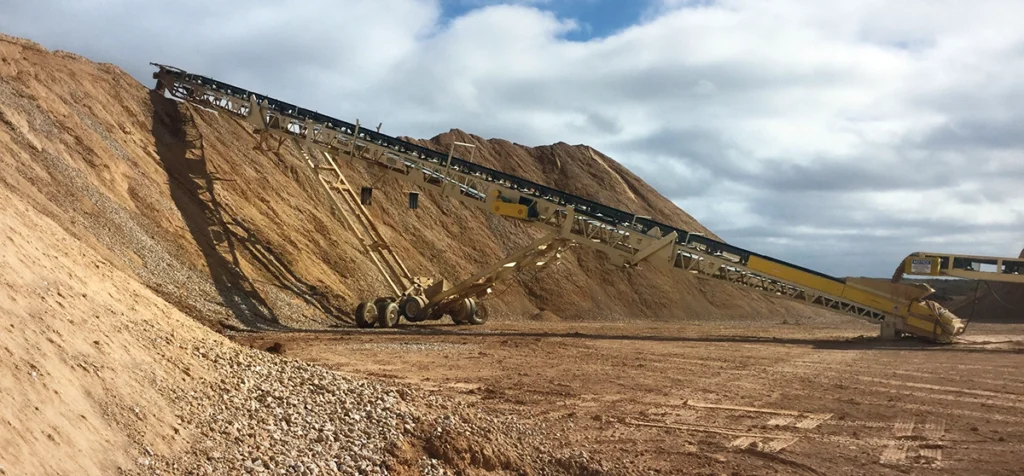 Photo of a portable stacking conveyor allows producer