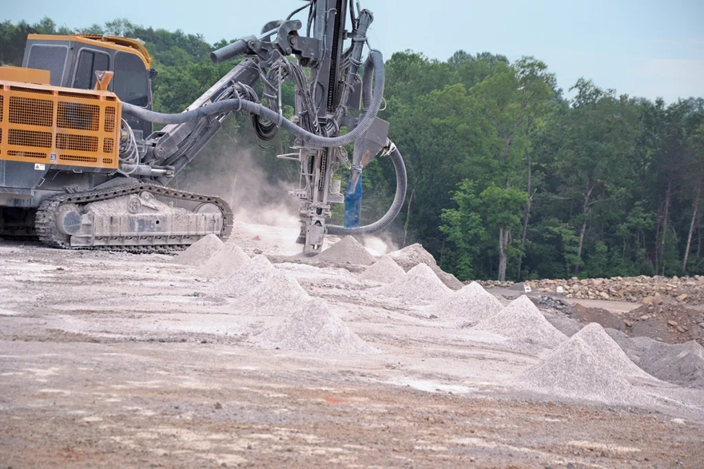 Photo showing cuttings and dust produced by drilling.