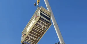 The screen seen here being lifted into position as part of a plant installation is one example of the steady, coordinated work that’s taking place within the industry this year. (Photo: Superior)