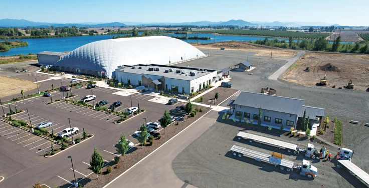 The Knife River Training Center features components such as an 80,000-sq.-ft. dome, indoor classrooms and a mock urban environment for training on equipment and underground work. (Photo: Knife River)