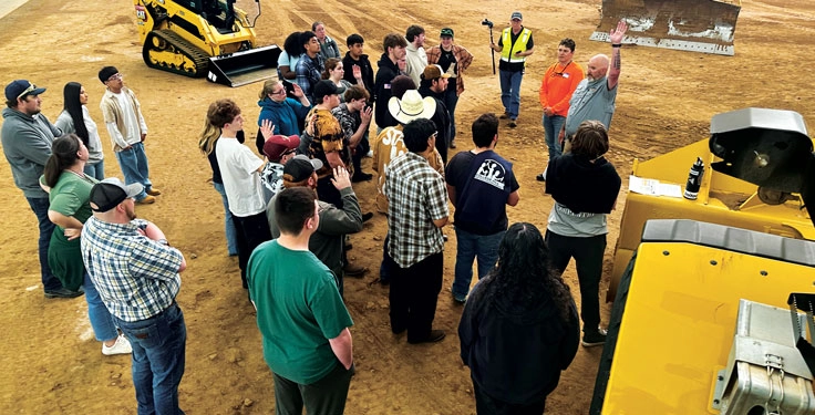 Knife River’s 200-ft. x 400-ft. dome features a dirt arena and concrete viewing platform, giving trainees ample room to safely walk around construction equipment. (Photo: Knife River)