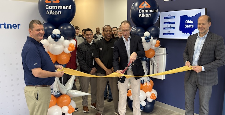 Command Alkon CEO Martin Willoughby cuts the ribbon on the company's new corporate headquarters. (Photo: P&Q Staff)