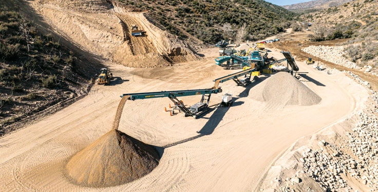 Dixon Rock & Materials’ mobile spread includes an M413 heavy-duty trommel, a 1300 Maxtrak cone crusher, a Chieftain 2200 inclined screen and four CT80 stacking conveyors. (Photo: Molson Group)