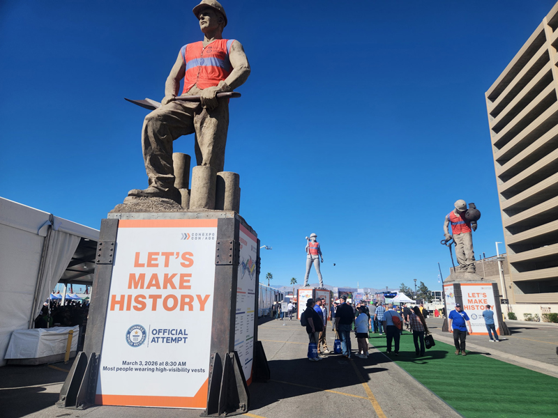The iconic ConExpo-Con/Agg statues are adorned in protective safety vests as the show attempted a Guiness World Records for the most people wearing high-visibility vests. (Photo: P&Q Staff)