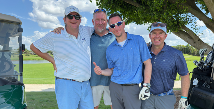 Finding some shade while playing through LaPlaya Golf Club are (from left) Craig Holman of BulkSource, Donald Ruppert of Astec, Daniel Geil of Scheerer Bearing Corp. and Jeremy Bell of Dirt Rocks. (Photo: P&Q Staff)
