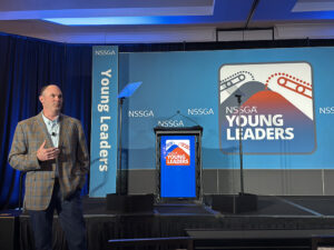 Ronnie Pruitt, CEO of Vulcan Materials, addresses attendees at NSSGA's 2026 Young Leaders Annual Meeting in Destin, Florida. (Photo: P&Q Staff)
